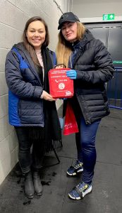 Erin Rose who is the sports therapist for The Raiders ice hockey team holding a Daniel Baird Bleed Control Kit donated by money raised by Adam's Angels.