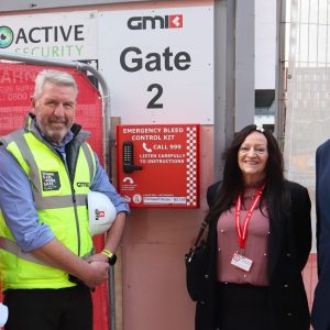 Representatives from GMI Construction, The Daniel Baird Foundation and Birmingham Council outside a construction project in Birmingham where GMI Construction installed a publicly accessible Turtle bleed control cabinet