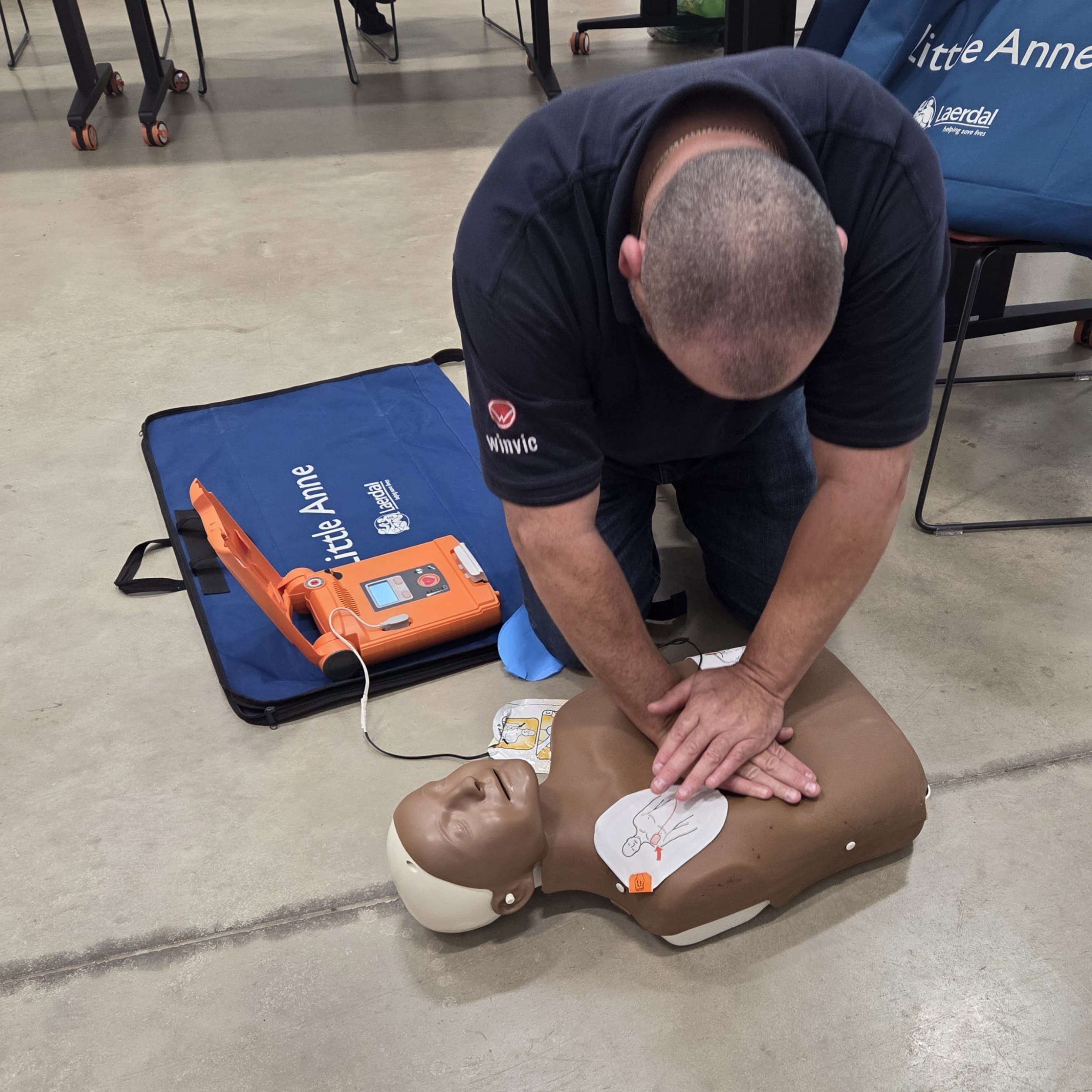 Winvic team member undertaking first aid trauma training Winvic team member in First Aid Trauma Training session facilitaed by Turtle with Abacus Training Centre.