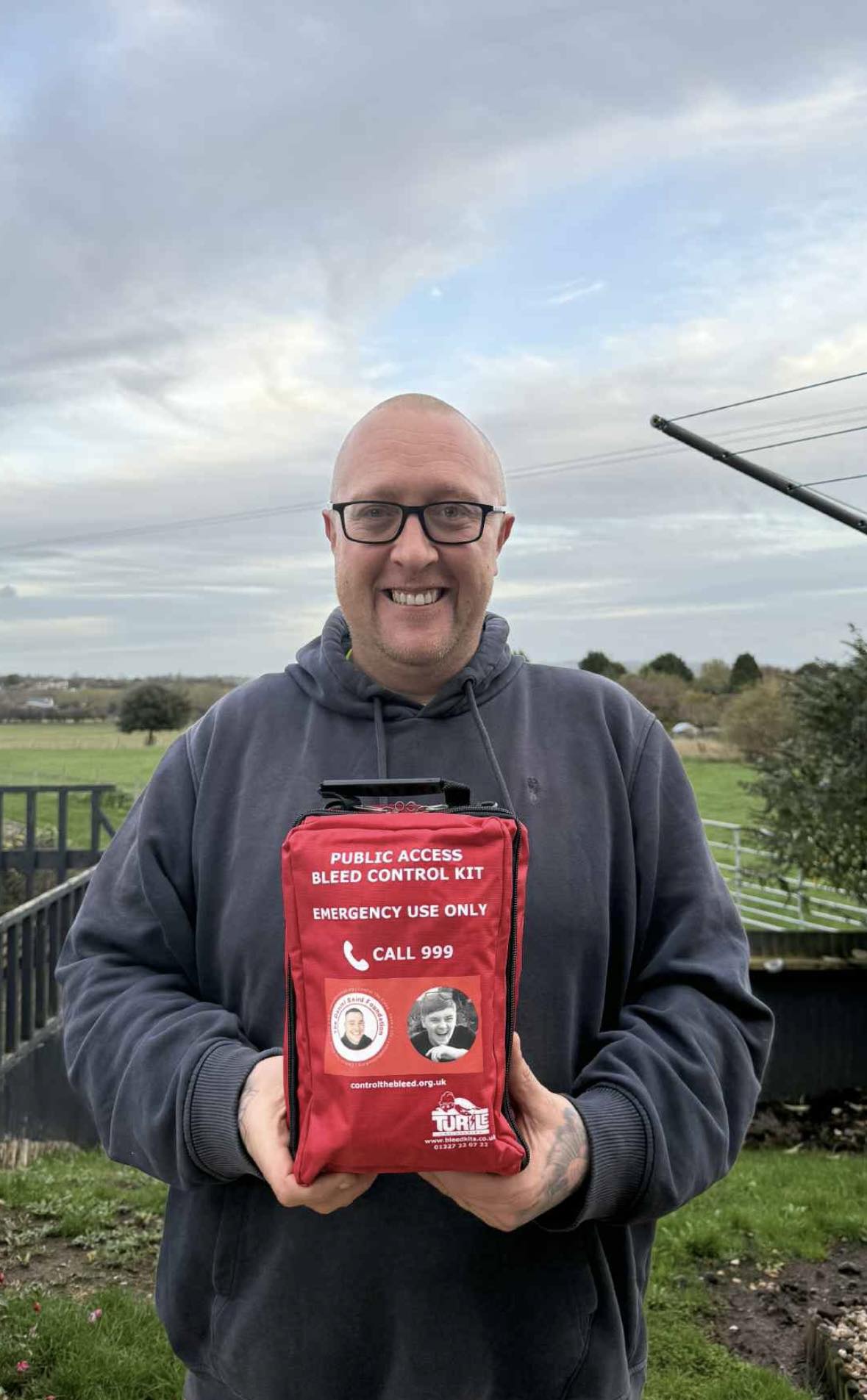 Kyle Hotchkins holding Daniel Baird bleed kit that has been customised to support 'Operation Lifesaver' bleed kits for schools initiative driven by the mother of Harvey Willgoose who was a victim of knife crime this year (Sheffield)
