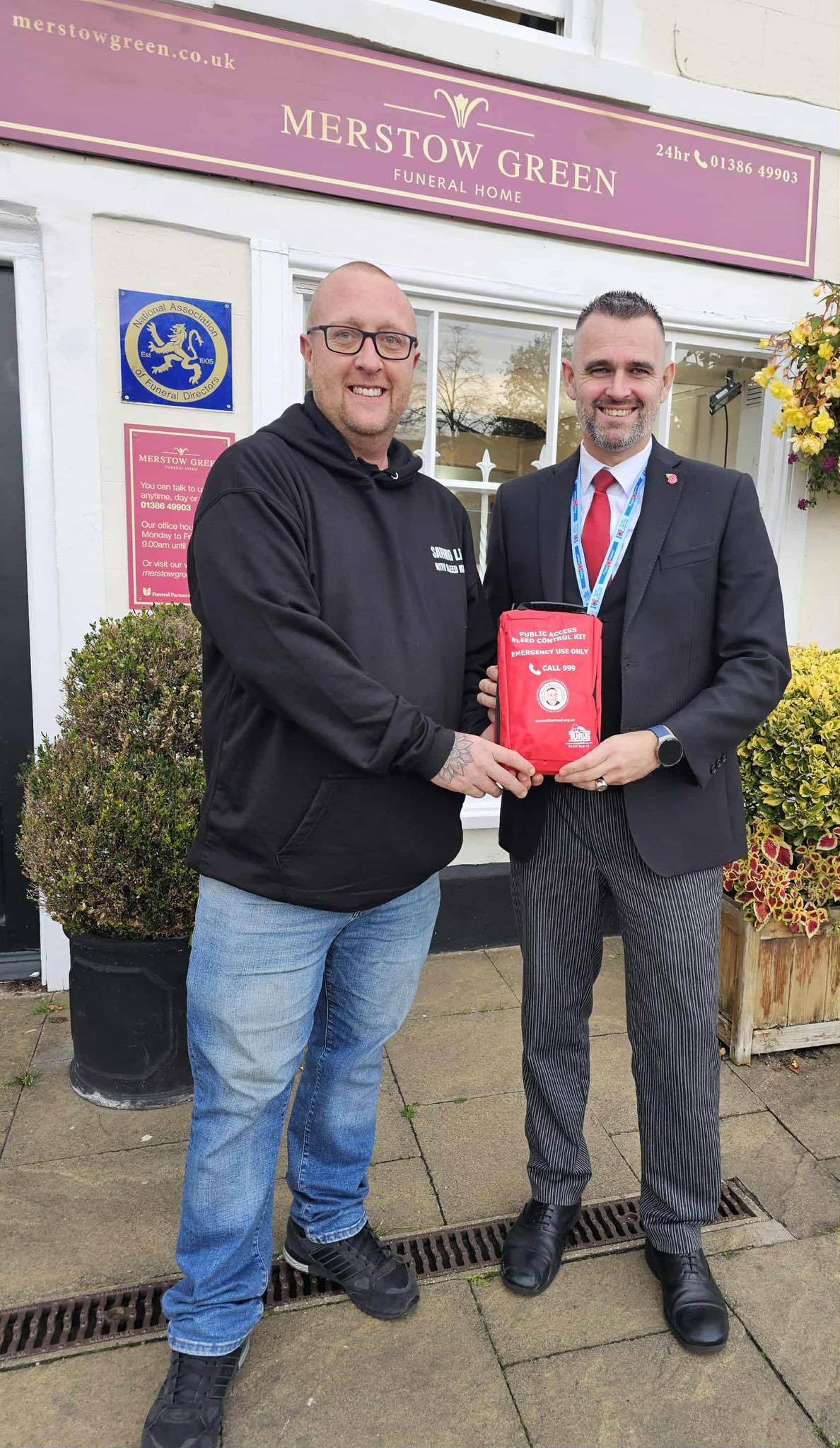 Kyle Hotchkins donating bleed control kit to local funeral home 